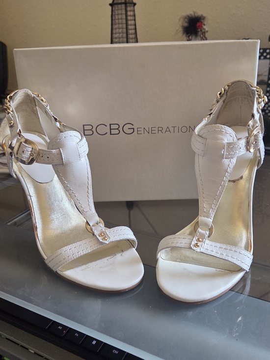 BCBGeneration Shoes - BCBGeneration White Leather T-Strap Sandals with Gold Accents